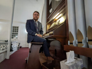 Man sitting at church organ